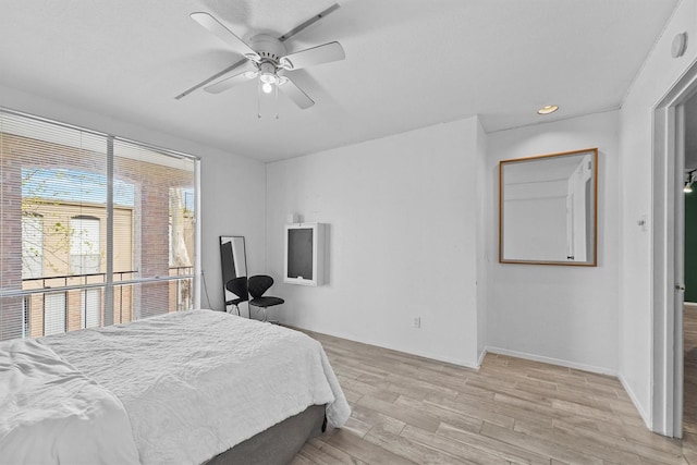 bedroom featuring ceiling fan and light wood-type flooring