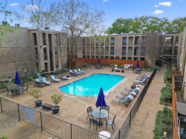 view of swimming pool featuring a patio