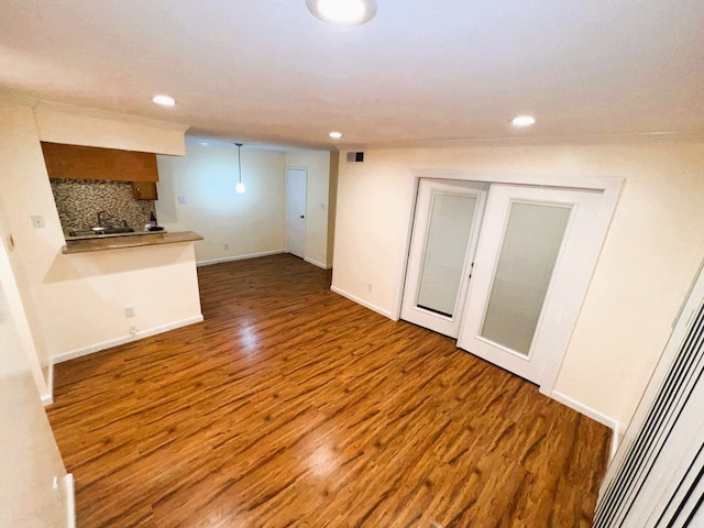 unfurnished living room featuring wood-type flooring