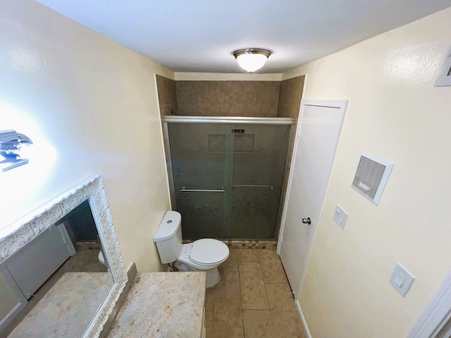 bathroom with toilet, a shower with shower door, and tile patterned floors