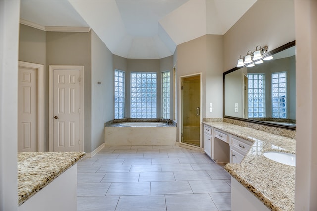 bathroom featuring vanity, shower with separate bathtub, and tile patterned flooring