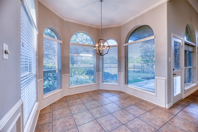 unfurnished dining area with crown molding, a chandelier, and light tile patterned floors