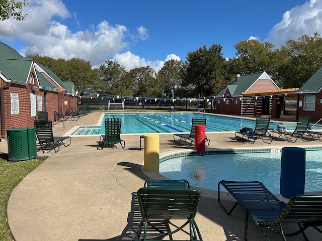 view of swimming pool with a patio area