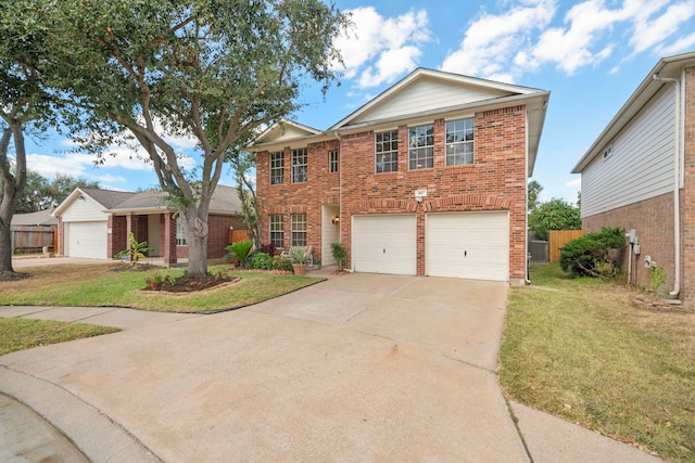 view of front of house with a front yard and a garage