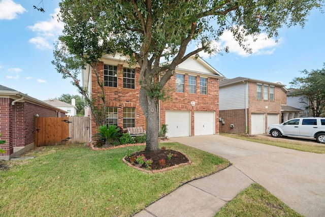 view of front of property featuring a front lawn and a garage