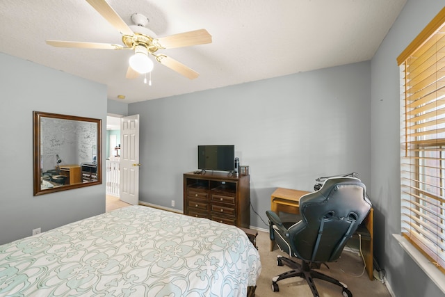 bedroom featuring ceiling fan and light colored carpet