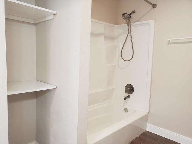 bathroom featuring hardwood / wood-style floors and shower / bathing tub combination