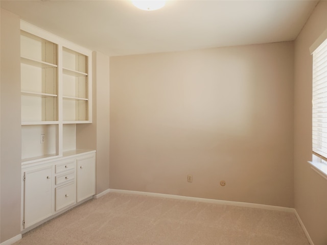 carpeted empty room with a wealth of natural light