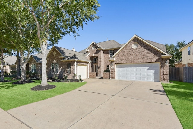 view of front facade with a front yard and a garage