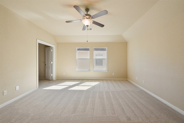 unfurnished room featuring light carpet, ceiling fan, and lofted ceiling