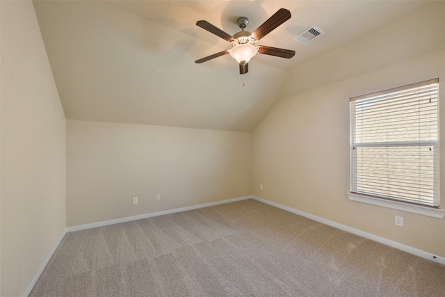 bonus room with light carpet, ceiling fan, and vaulted ceiling