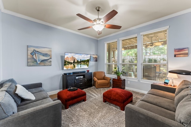 living room with carpet floors, ceiling fan, and crown molding