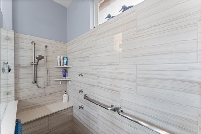 bathroom with tiled shower