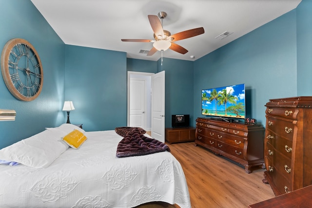 bedroom with ceiling fan and light wood-type flooring