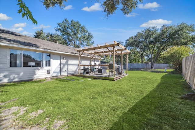 view of yard featuring a deck and a pergola