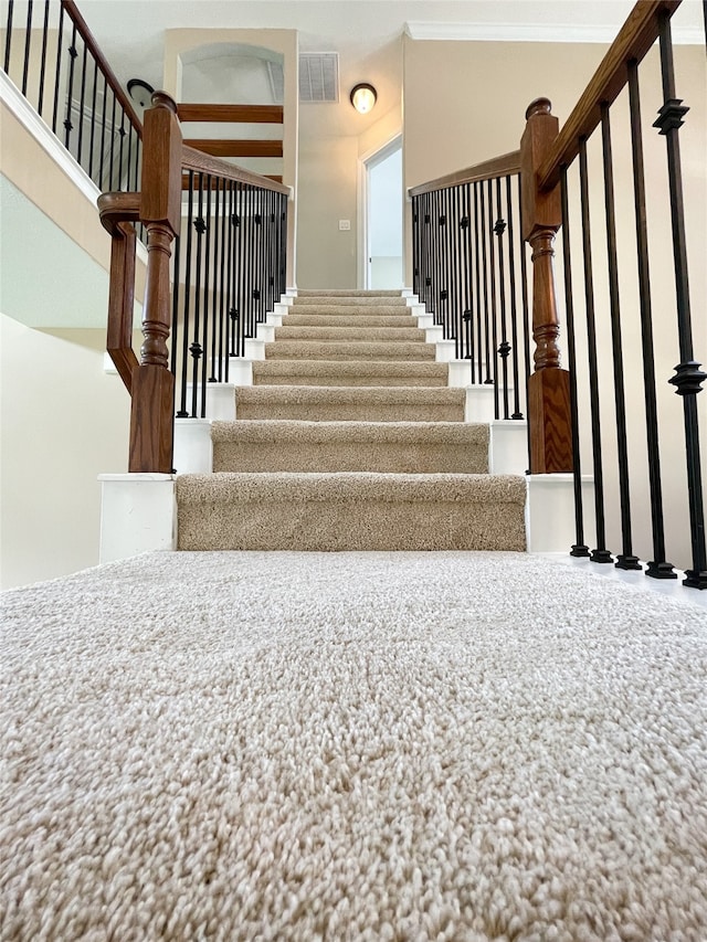 stairs with crown molding