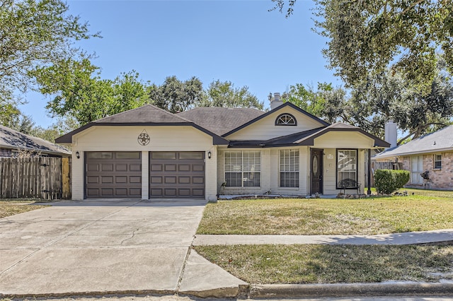 single story home featuring a front lawn and a garage