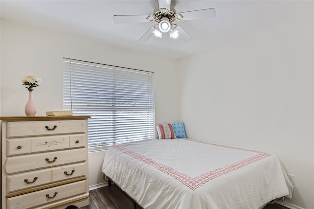 bedroom featuring dark wood-type flooring and ceiling fan