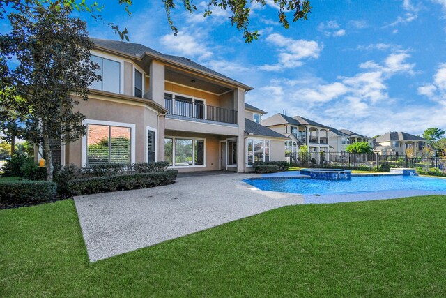 23011 Little Harbor Way, Katy, TX 77494 - view of pool featuring a fenced backyard, a patio area, a lawn, a pool with connected hot tub, and a residential view