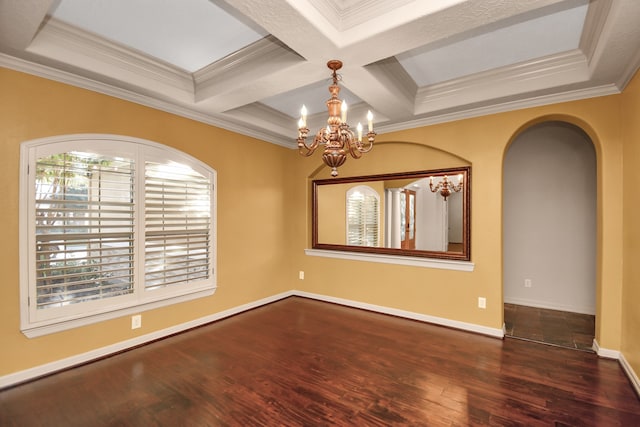 unfurnished room featuring an inviting chandelier, ornamental molding, beamed ceiling, dark wood-type flooring, and coffered ceiling