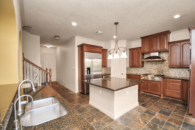 kitchen with sink, backsplash, hanging light fixtures, stainless steel appliances, and ventilation hood