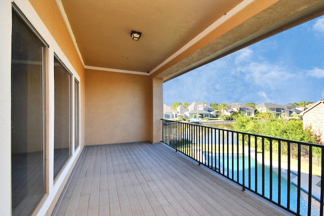 deck with a residential view and a fenced in pool