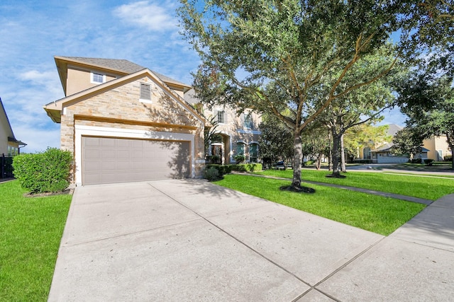 traditional-style house featuring a garage, concrete driveway, a front lawn, and stone siding