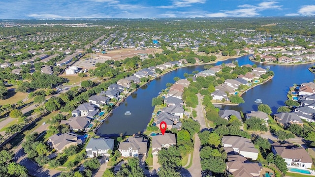 birds eye view of property featuring a water view and a residential view