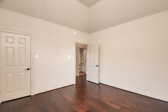 empty room with dark hardwood / wood-style floors