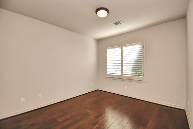 empty room featuring hardwood / wood-style flooring