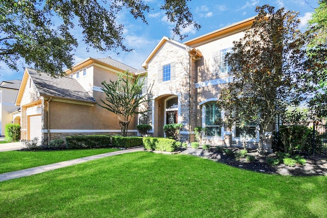 view of front of property with a front lawn, stone siding, and stucco siding