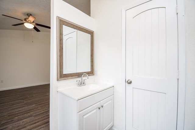 bathroom featuring vanity, ceiling fan, and hardwood / wood-style floors