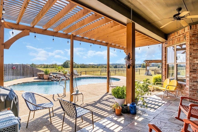 view of pool featuring a hot tub, a patio, and ceiling fan