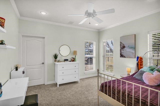 carpeted bedroom featuring ornamental molding, multiple windows, and ceiling fan