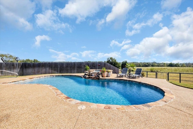 view of swimming pool featuring a patio area