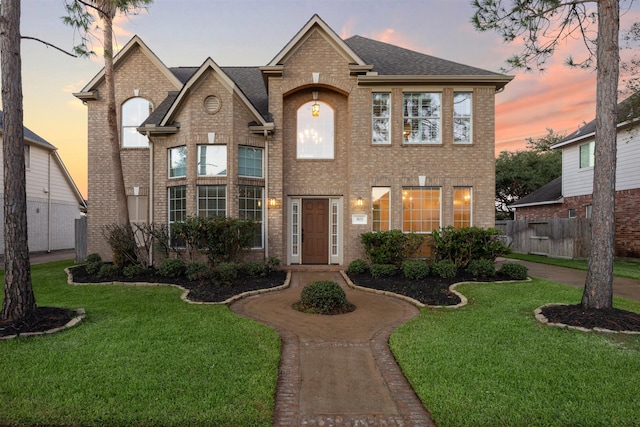 view of front of property with a yard