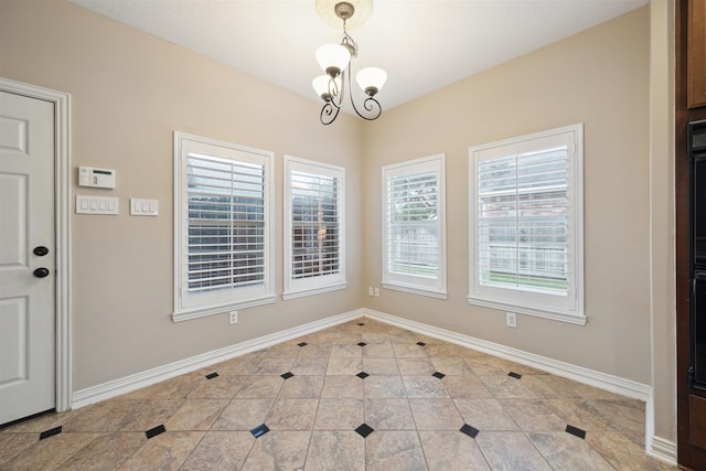 unfurnished dining area with an inviting chandelier and tile patterned flooring