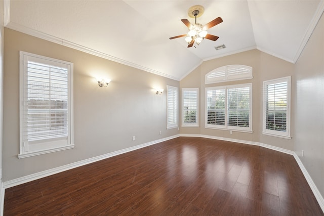 unfurnished room with crown molding, vaulted ceiling, a healthy amount of sunlight, and dark hardwood / wood-style flooring