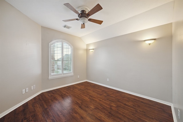 empty room featuring vaulted ceiling, ceiling fan, and dark hardwood / wood-style flooring