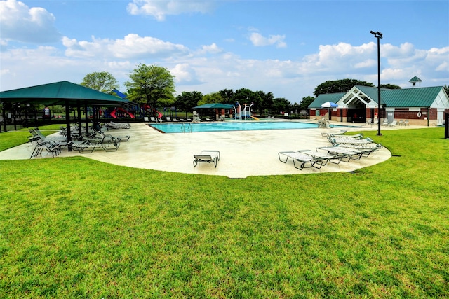 view of swimming pool featuring a patio, a gazebo, and a lawn