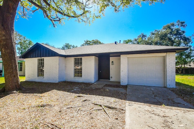 ranch-style home featuring a garage