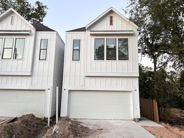 modern inspired farmhouse featuring a garage