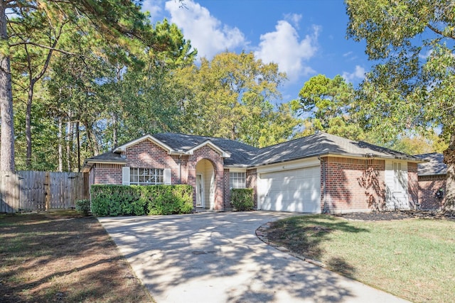 ranch-style house featuring a garage and a front lawn