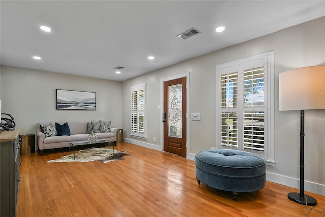 living room with light hardwood / wood-style flooring