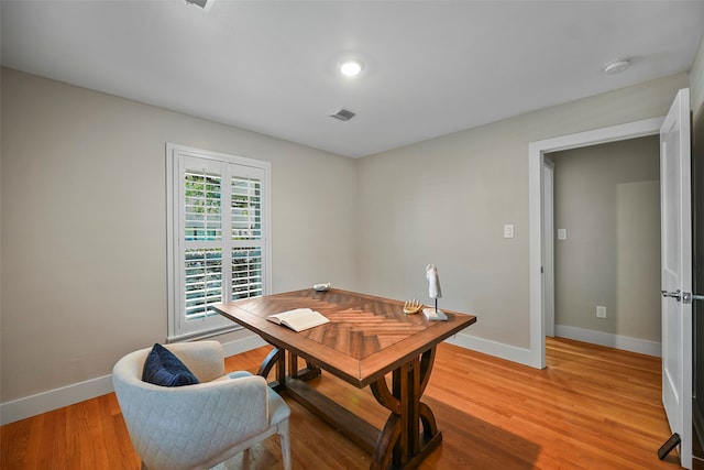 dining room with light hardwood / wood-style flooring