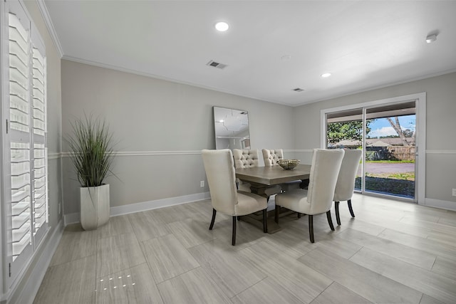 dining area featuring ornamental molding