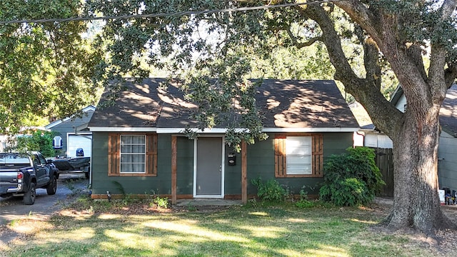 bungalow with a front lawn