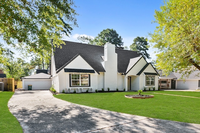 view of front of home featuring a garage, a front lawn, and central AC unit