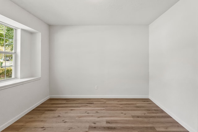 empty room with light wood-type flooring