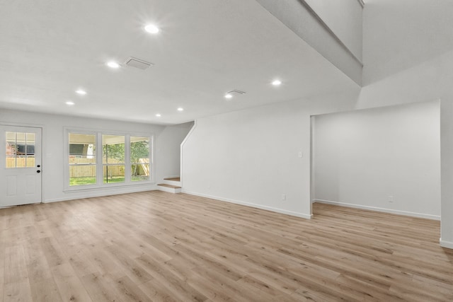 unfurnished living room with light wood-type flooring